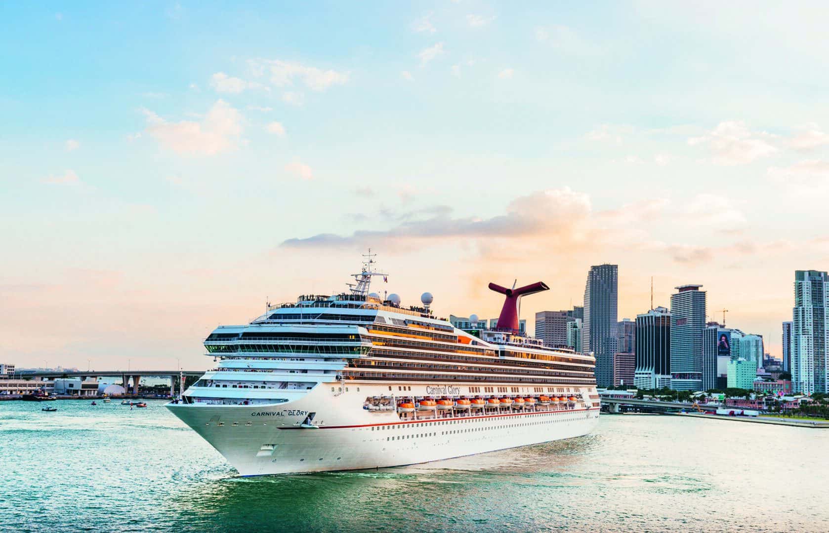 Cruise Ship Downtown Port of Miami Florida Travel Destinations USA Miami, United States - November 19, 2016: A large passenger cruise ship, the Carnival Glory, turns around in Biscayne Bay as it prepares to exit the downtown Port of Miami via Government Cut.