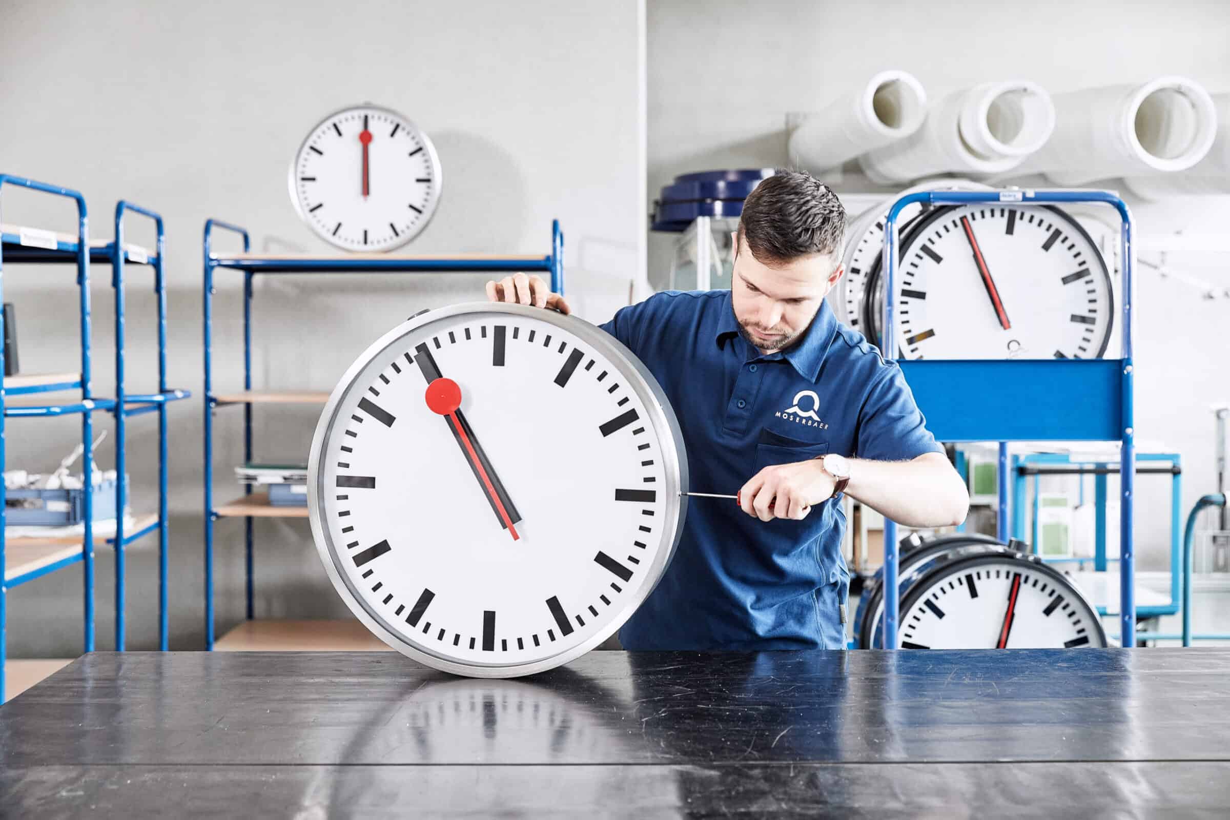 Image of analogue outdoor clocks, including an SBB railway clock, representing time accuracy and quality