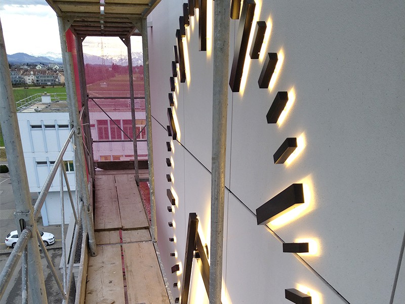 Innovative facade clock - from conception to installation