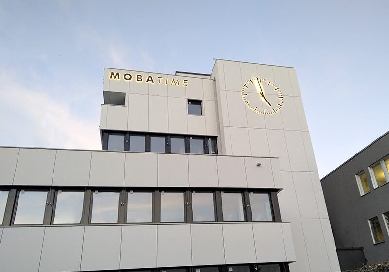 Final installation phase of a facade clock located in Dübendorf