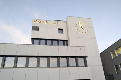 Final installation phase of a facade clock located in Dübendorf